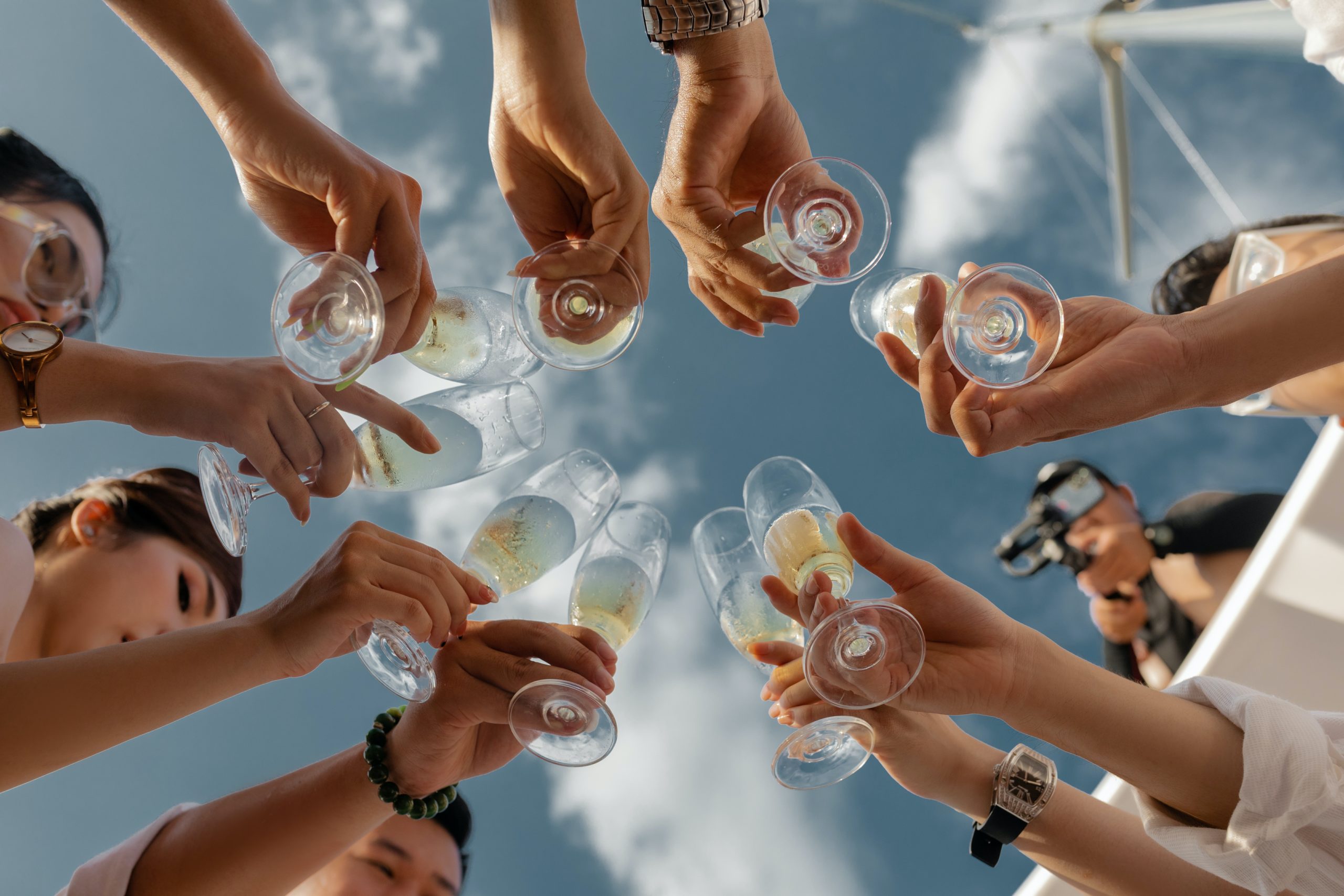 Friends toasting with Fukucho Seaside Sparkling Sake